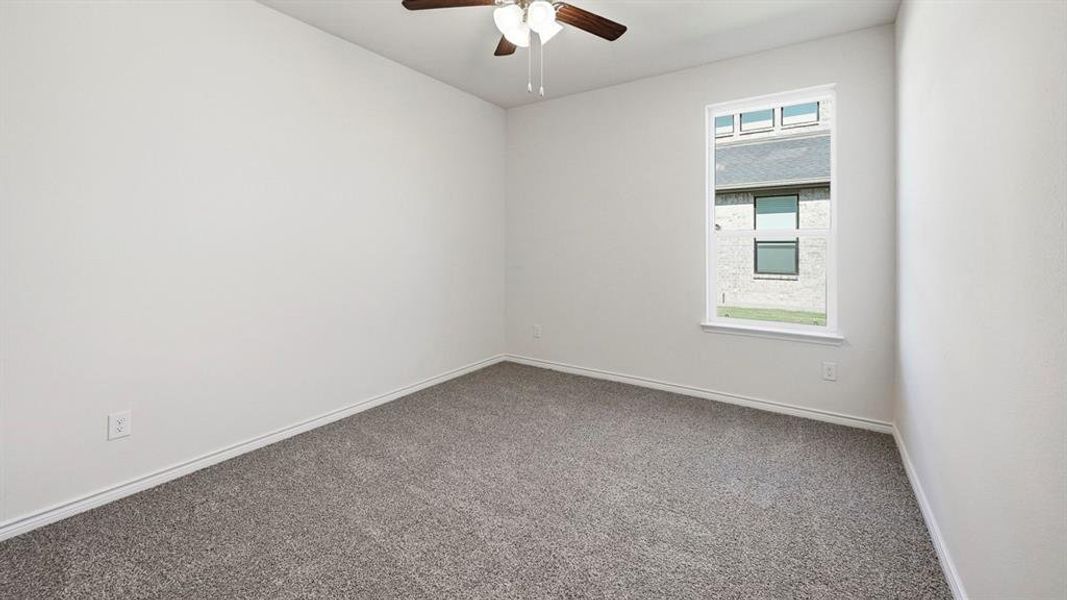 Unfurnished room with carpet floors and ceiling fan