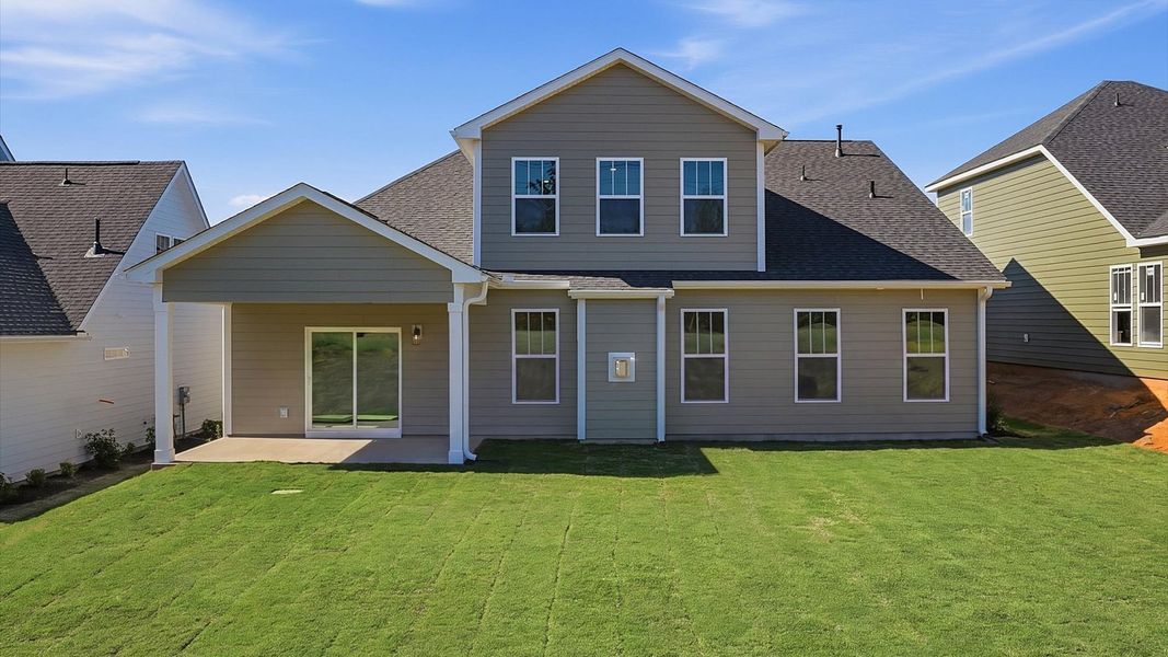 Exclusive rear exterior featuring a covered porch with accomplished detail and elevated outdoor living potential in SC Exclusive rear exterior featuring a covered porch with accomplished detail and elevated outdoor living potential in SC