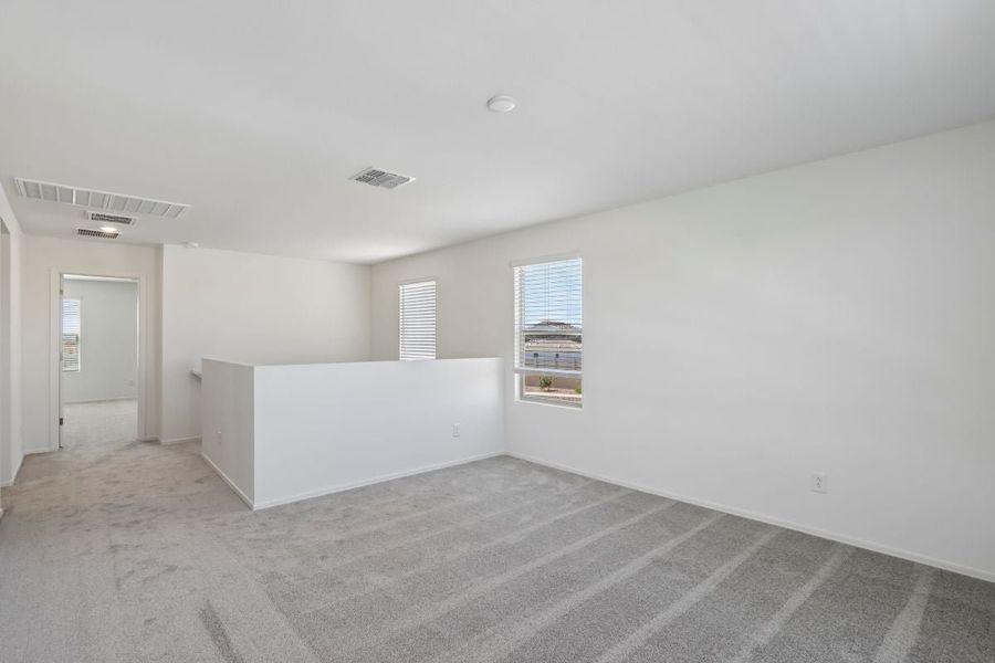 Spacious, unfurnished interior of a new home in Skyline Village Enclaves, San Tan Valley (Image 13).