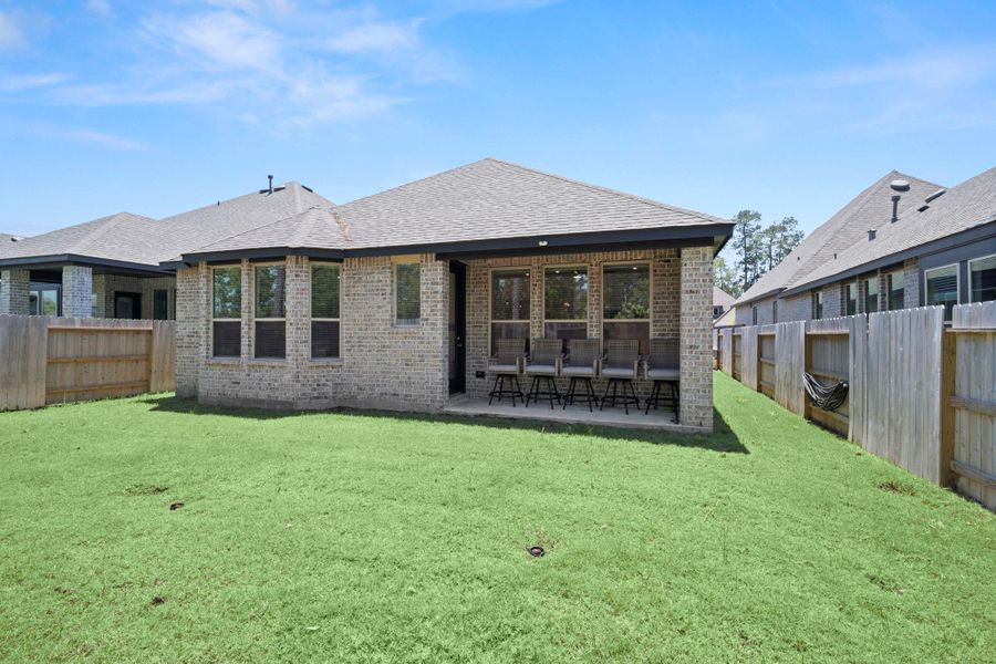 Exterior details and patio area of a home in Evergreen, Conroe (Image 4). Exterior details and patio area of a home in Evergreen, Conroe (Image 4).