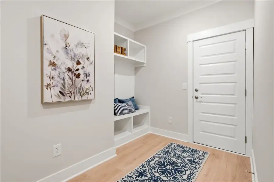 An inviting entryway welcomes guests with clean li