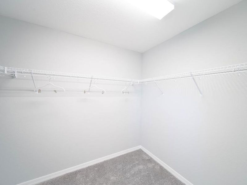 Your owner`s oasis also includes a spacious walk-in wardrobe - Magnolia townhome by Highland Homes