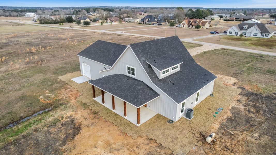 Exterior details and patio area of a home in , New Waverly (Image 31).