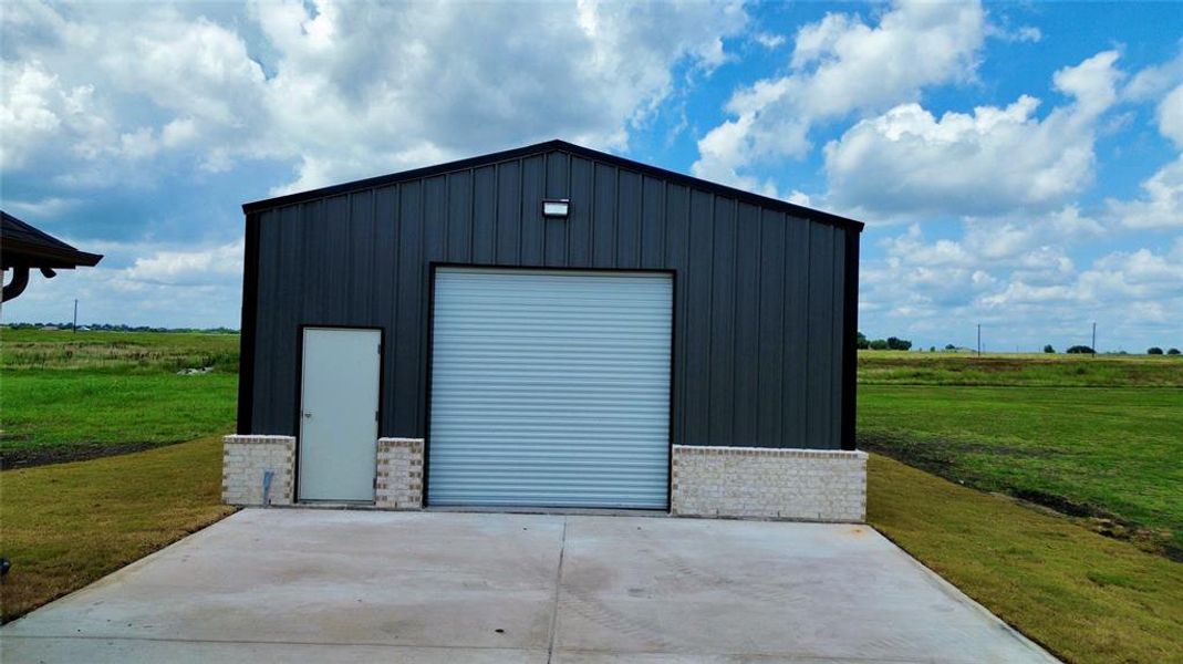 View of outdoor structure featuring a view of rural / pastoral area
