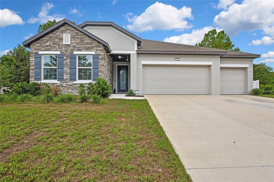 Front exterior of a new home in , Homosassa, FL, highlighting curb appeal (Image 21). Front exterior of a new home in , Homosassa, FL, highlighting curb appeal (Image 21).