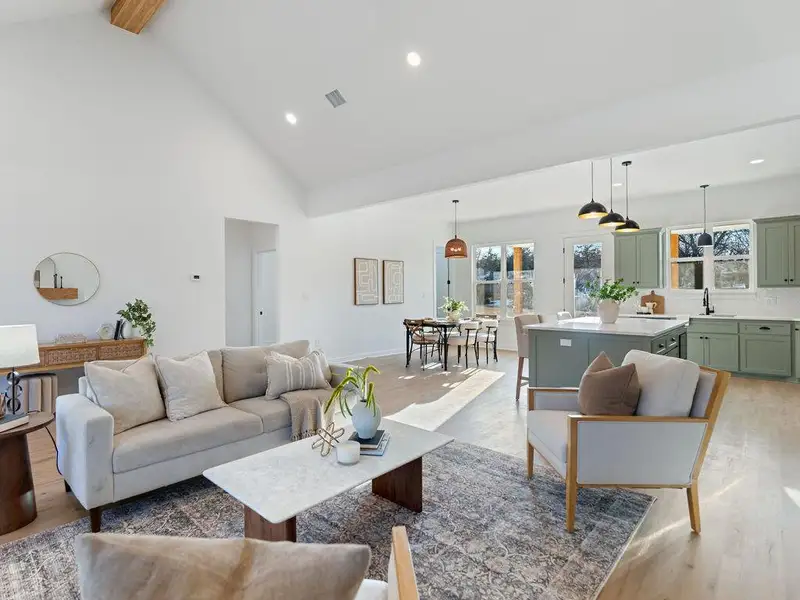 Living room with recessed lighting and wood finished floors