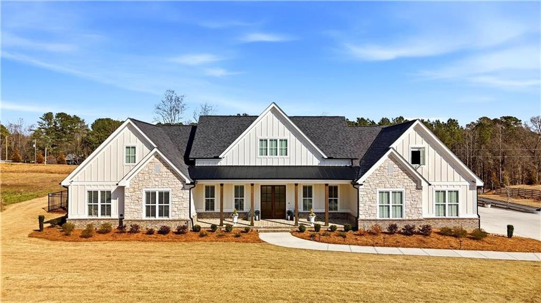 Front exterior of a new home in , Woodstock, GA, highlighting curb appeal (Image 22). Front exterior of a new home in , Woodstock, GA, highlighting curb appeal (Image 22).