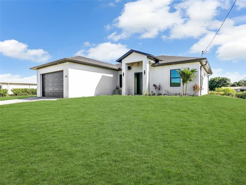 Front exterior of a new home in , Cape Coral, FL, highlighting curb appeal (Image 2). Front exterior of a new home in , Cape Coral, FL, highlighting curb appeal (Image 2).