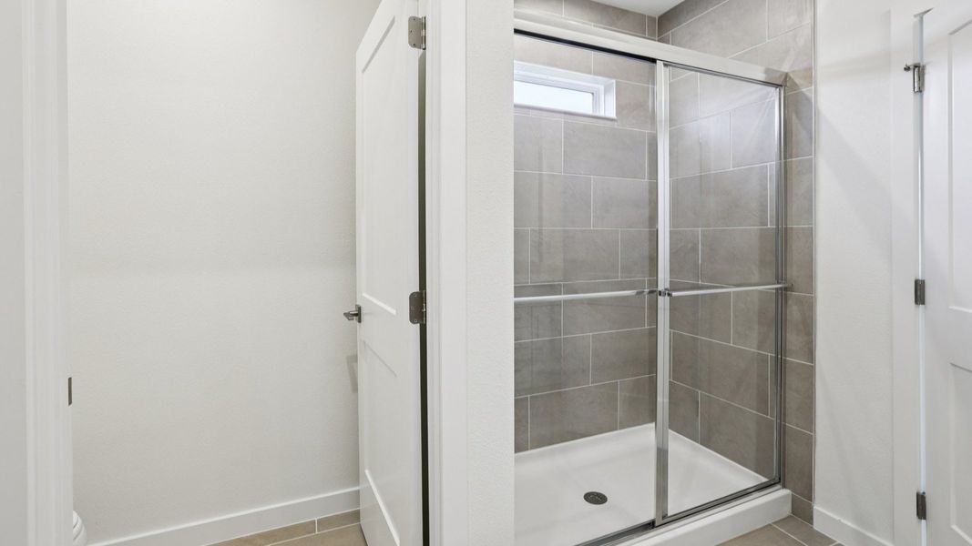 Naples First Floor Primary Suite suite bath at Grasslands West in Lakeland FL