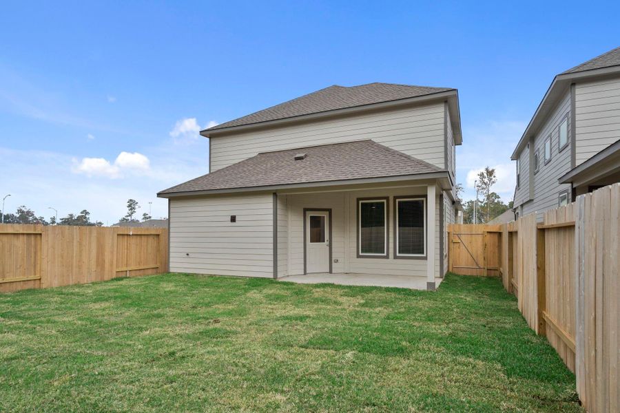 Exterior details and patio area of a home in Cypresswood Landing, Humble (Image 4).