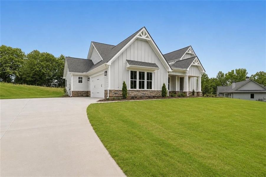 Front exterior of a new home in , Statham, GA, highlighting curb appeal (Image 27).