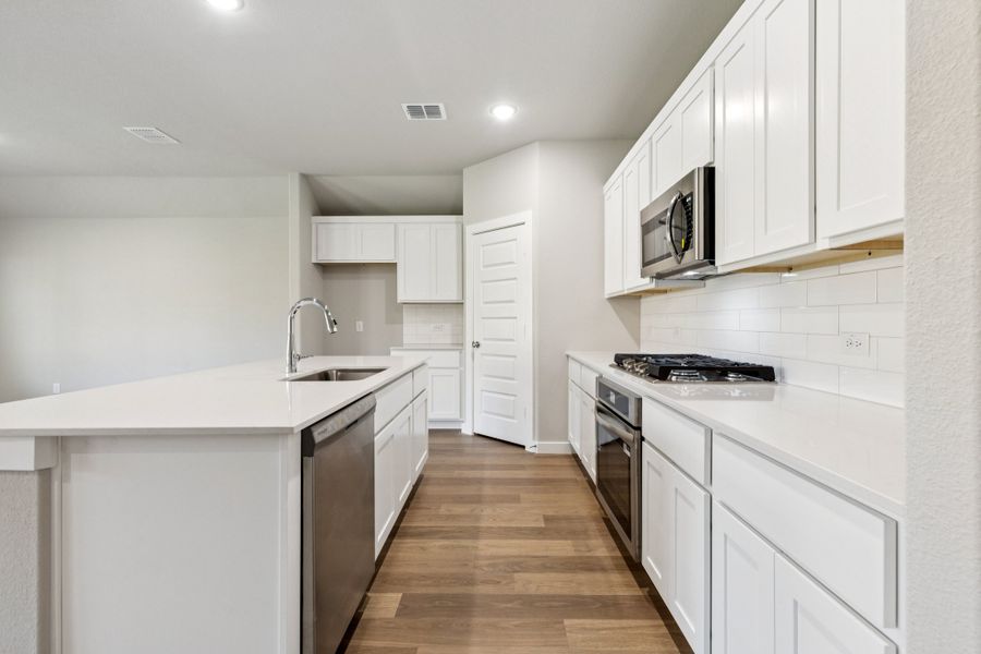 Kitchen in the Emmy II home plan by Trophy Signature Homes - REPRESENTATIVE PHOTO Kitchen in the Emmy II home plan by Trophy Signature Homes - REPRESENTATIVE PHOTO