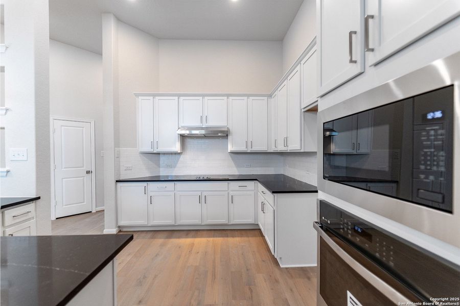 Furnished interior view inside a new home in The Woodlands at Medina Hills, Mico (Image 8).