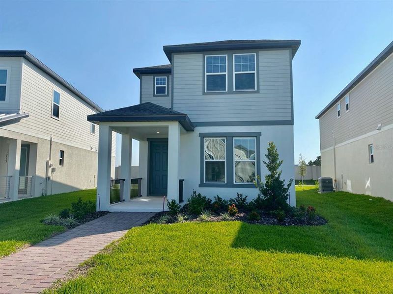 Front exterior of a new home in , Winter Garden, FL, highlighting curb appeal (Image 1). Front exterior of a new home in , Winter Garden, FL, highlighting curb appeal (Image 1).