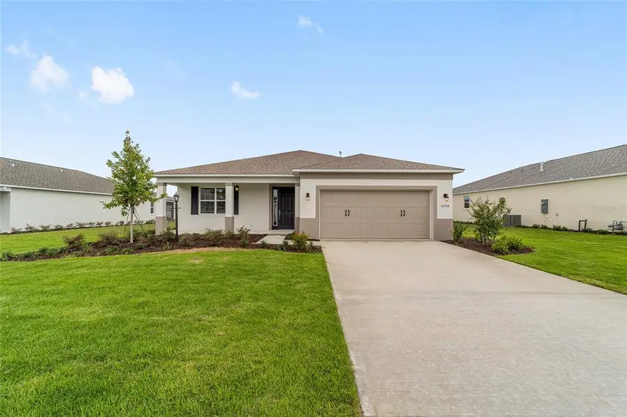 Front exterior of a new home in , Ocala, FL, highlighting curb appeal (Image 21). Front exterior of a new home in , Ocala, FL, highlighting curb appeal (Image 21).