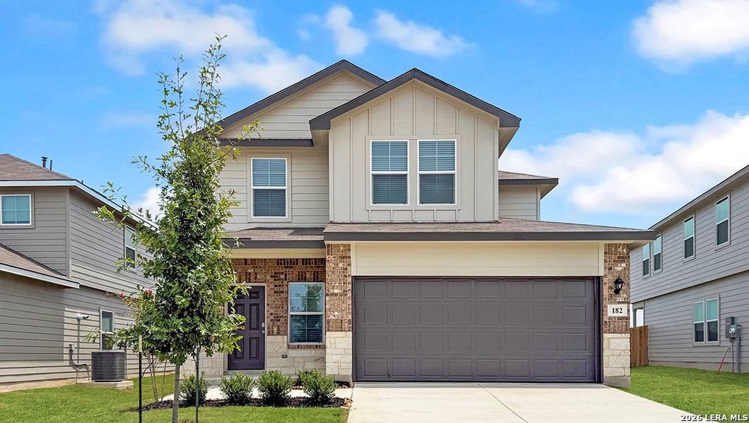 Front exterior of a new home in Redbird Ranch, San Antonio, TX, highlighting curb appeal (Image 2).