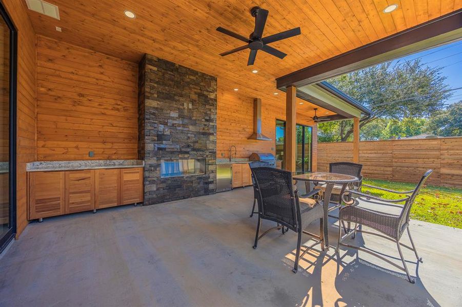View of patio / terrace featuring an outdoor kitchen, ceiling fan, and outdoor dining area View of patio / terrace featuring an outdoor kitchen, ceiling fan, and outdoor dining area