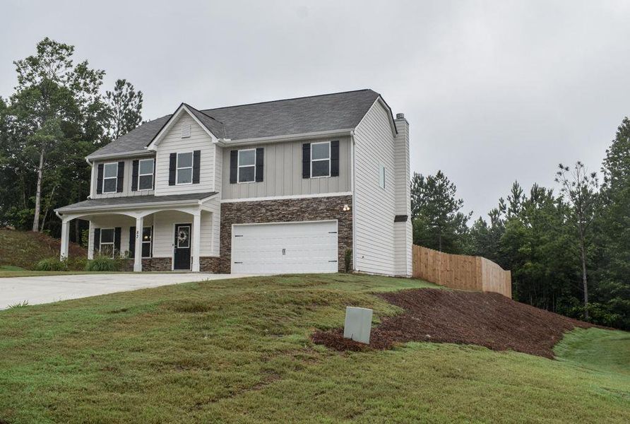 Front exterior of a new home in , Dallas, GA, highlighting curb appeal (Image 33). Front exterior of a new home in , Dallas, GA, highlighting curb appeal (Image 33).