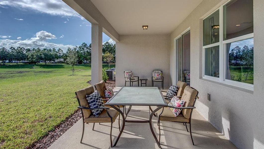 Exterior details and patio area of a home in Mockingbird Reserve at Winding Oaks, Ocala (Image 3).