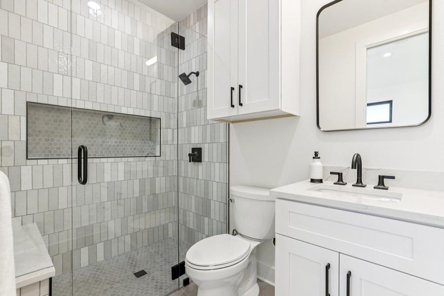 Designed with a modern touch, the bathrooms blend style with daily function.