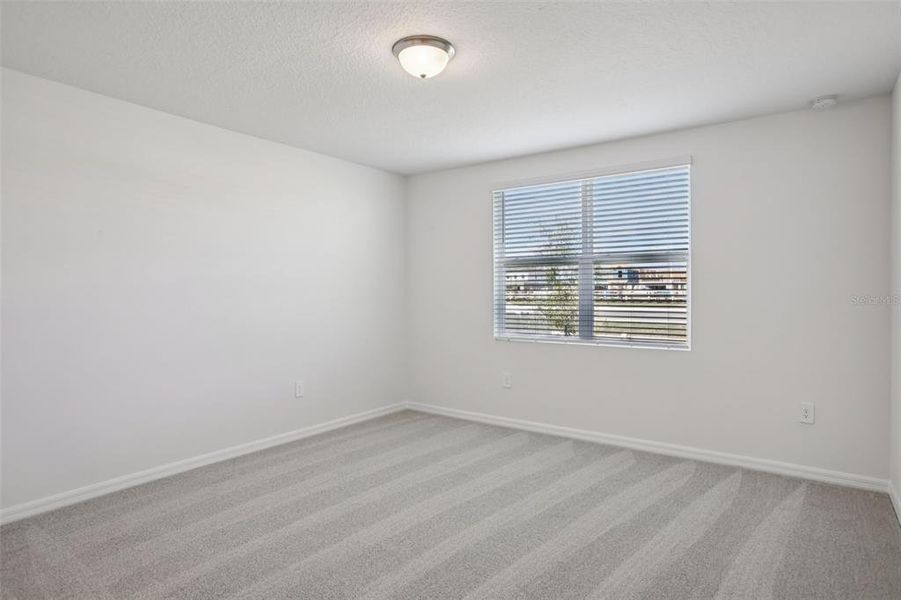 Spacious, unfurnished interior of a new home in Villamar - Signature Series, Winter Haven (Image 25).