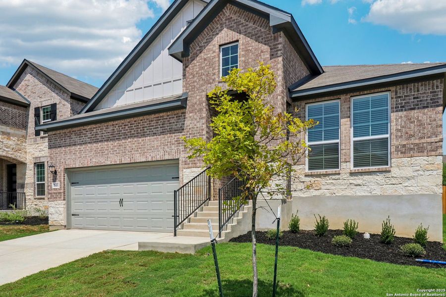 Front exterior of a new home in Sagebrooke - Classic Series, San Antonio, TX, highlighting curb appeal (Image 25).