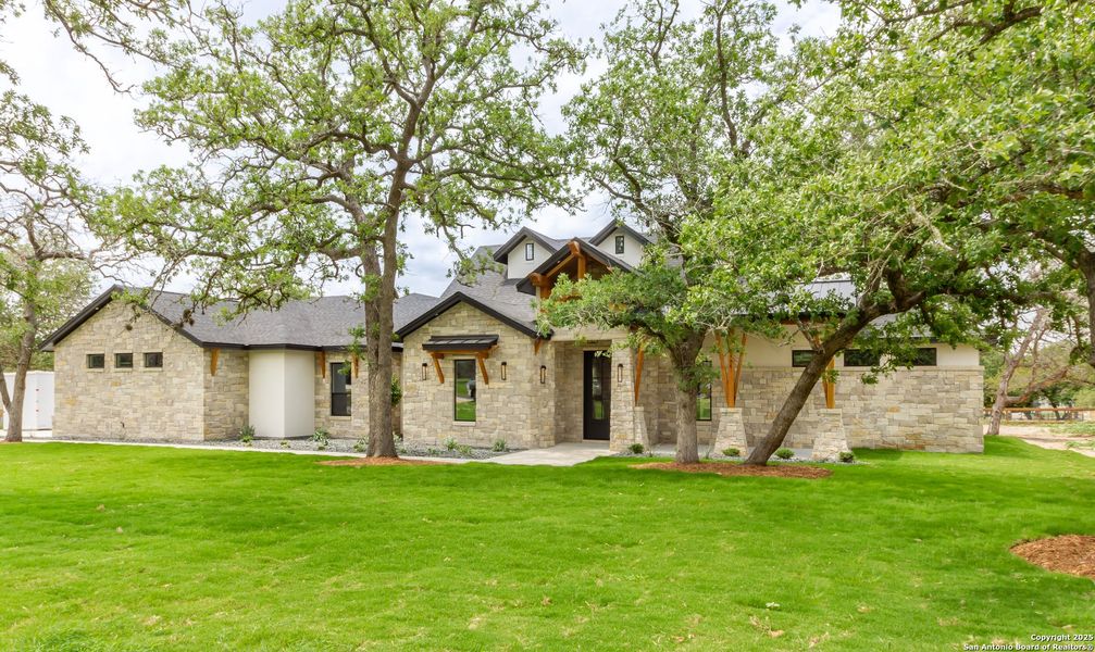 Front exterior of a new home in , La Vernia, TX, highlighting curb appeal (Image 30).