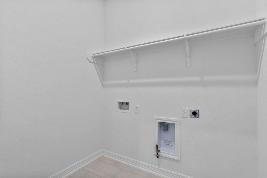 The laundry room layout is carefully planned for optimal workflow with designated areas for washing, drying, and storing. The laundry room layout is carefully planned for optimal workflow with designated areas for washing, drying, and storing.