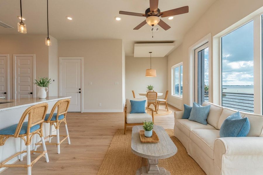 Virtually staged image of the living and dining with kitchen on the left