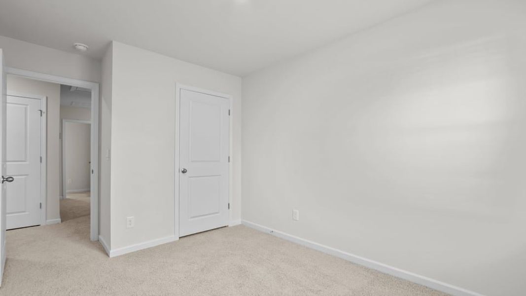 Spacious, unfurnished interior of a new home in The Townes at Ridgewood Farms, Winterville (Image 30).