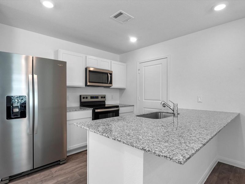 Furnished interior view inside a new home in William Trails, Willis (Image 9).