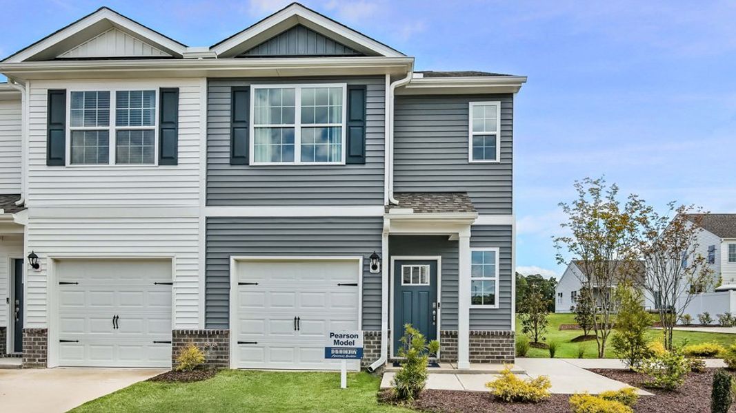 Representative exterior photo of a completed home built from the PEARSON by D.R. Horton in The Townes at Prestleigh, Wake Forest, NC (Image 19).