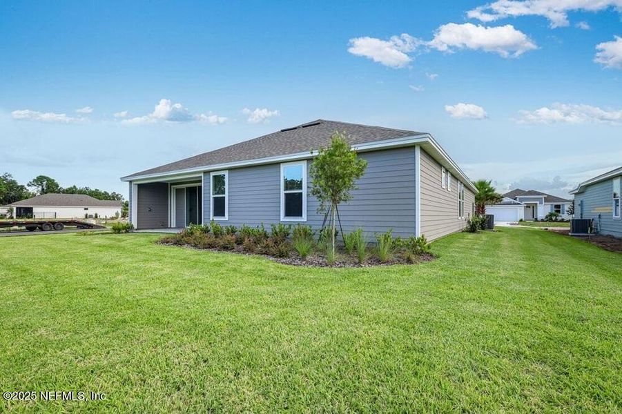 Exterior details and patio area of a home in Colbert Landings, Palm Coast (Image 3).