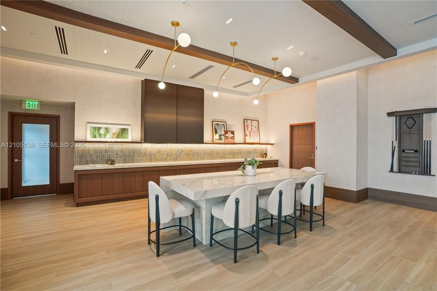 Wood-finish flooring with a large stone-finish communal table