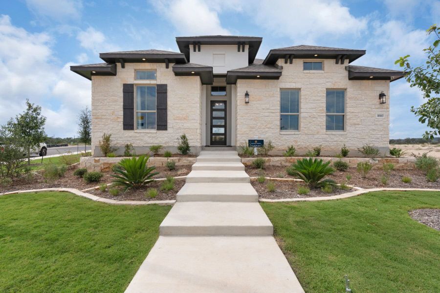 Front exterior of a new home in Davis Ranch, San Antonio, TX, highlighting curb appeal (Image 1).