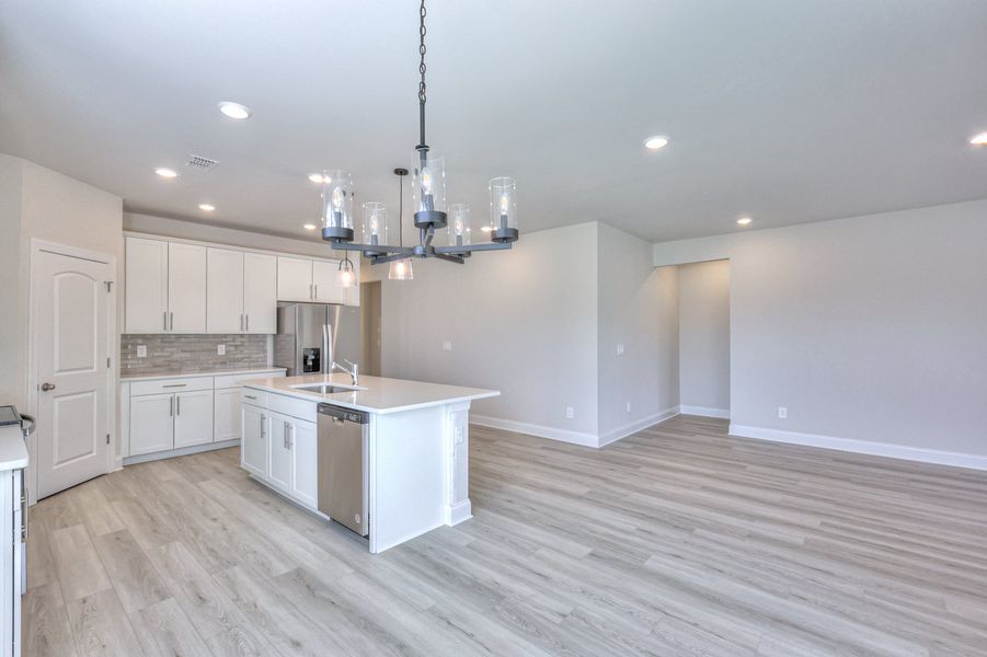 The open-concept floorplan allows for an easy flow between the kitchen and dining areas.