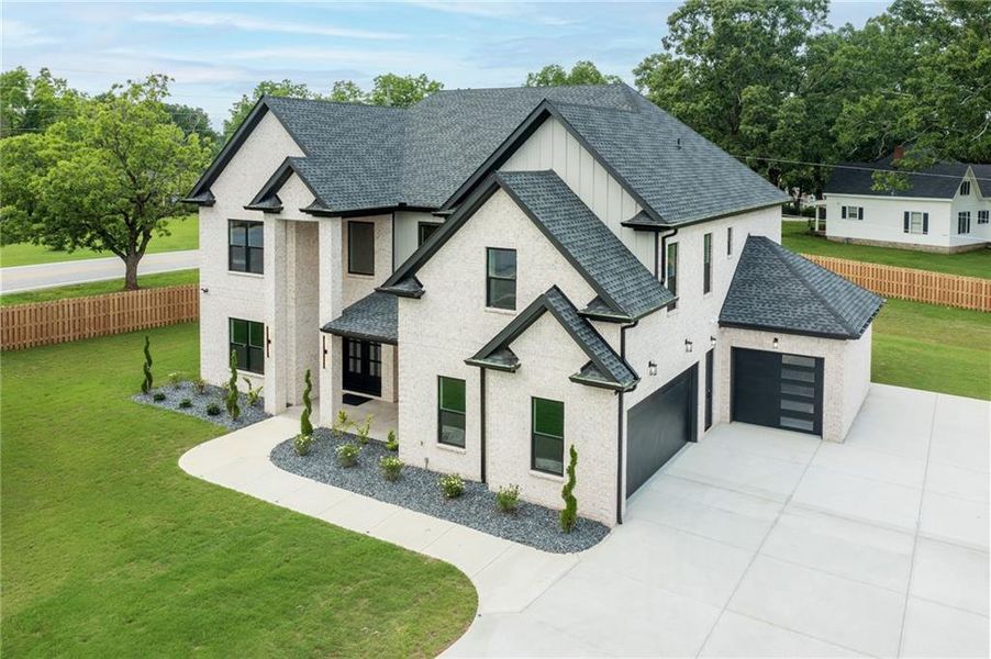 Front exterior of a new home in , Grayson, GA, highlighting curb appeal (Image 31).