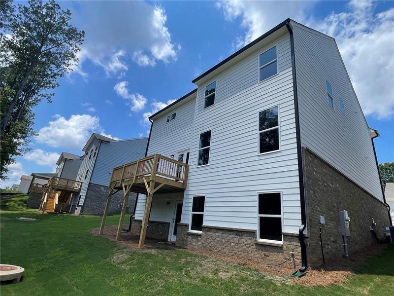 Front exterior of a new home in Edenglen, Buford, GA, highlighting curb appeal (Image 14).