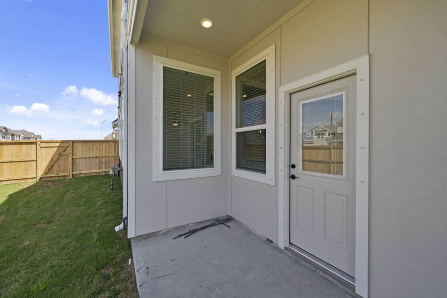 Exterior details and patio area of a home in Meridiana, Manvel (Image 21).