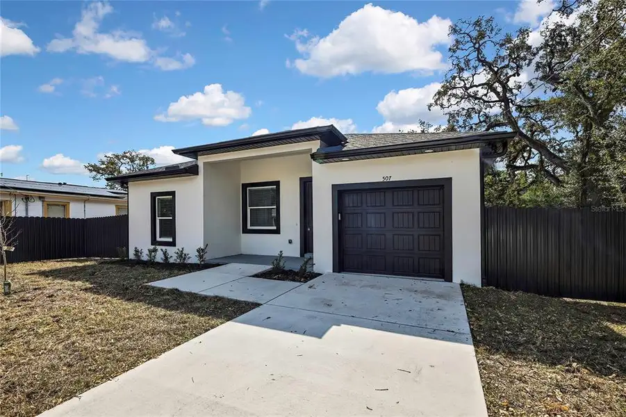 Front exterior of a new home in , Tampa, FL, highlighting curb appeal (Image 19).