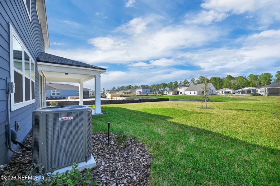 Exterior details and patio area of a home in Hyland Trail, Green Cove Springs (Image 4).