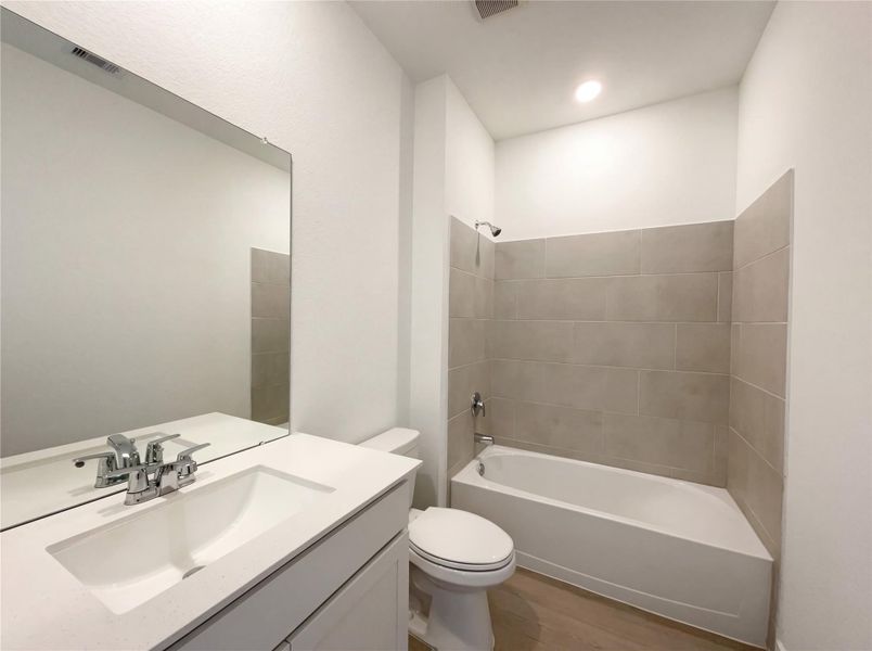 Furnished interior view inside a new home in Sunterra, Katy (Image 6).