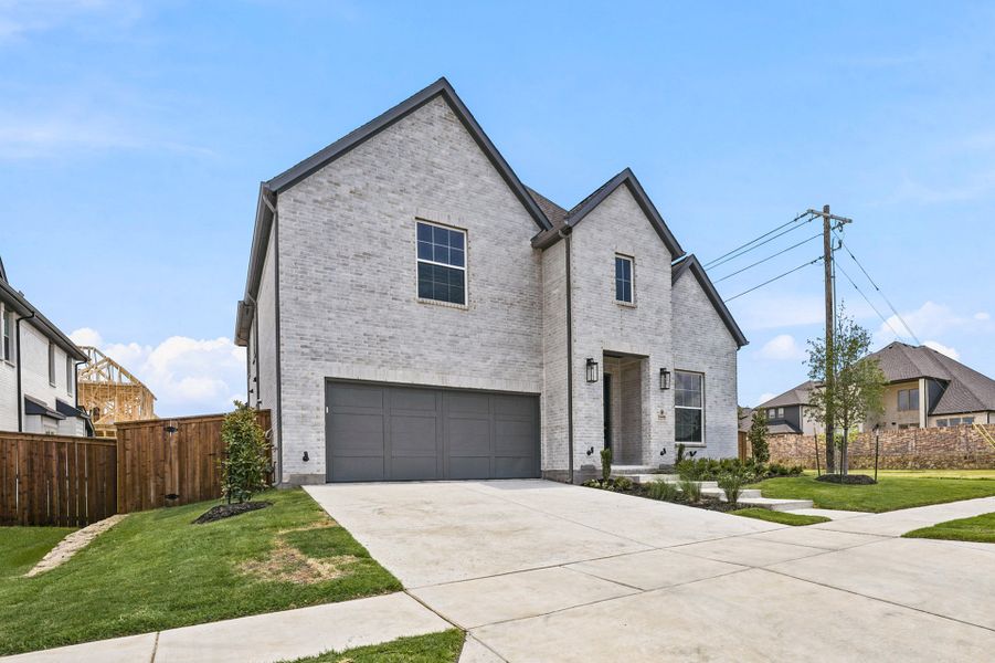 Front exterior of a new home in Estates at Rockhill, Frisco, TX, highlighting curb appeal (Image 25).