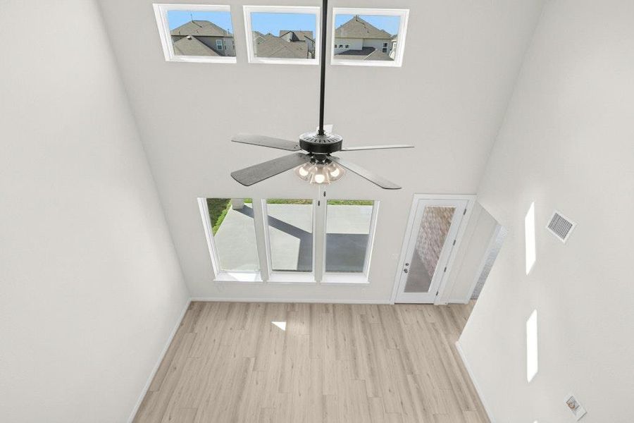 Detailed view of wood finished floors and ceiling fan