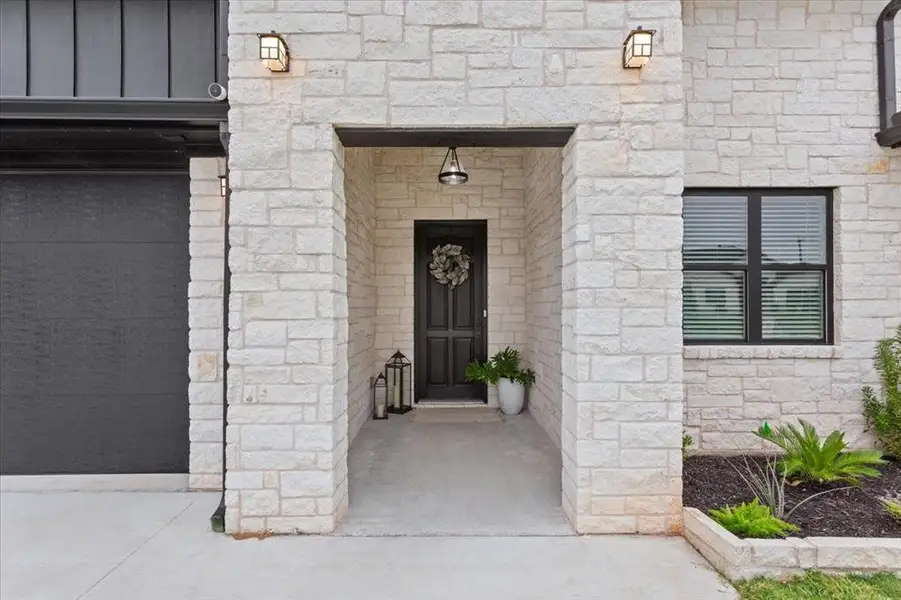 Exterior details and patio area of a home in , Hewitt (Image 28).