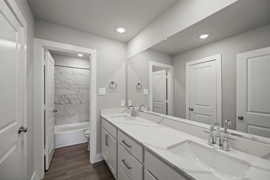 Beautifully designed bathrooms with sleek vanities and quality fixtures.