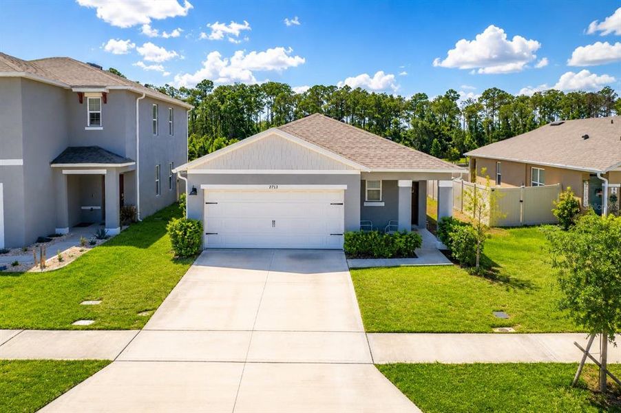 Front exterior of a new home in , Harmony, FL, highlighting curb appeal (Image 23). Front exterior of a new home in , Harmony, FL, highlighting curb appeal (Image 23).