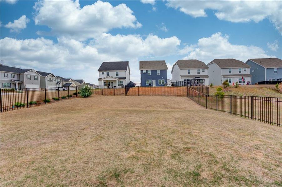 Exterior details and patio area of a home in Twin Lakes, Hoschton (Image 19).