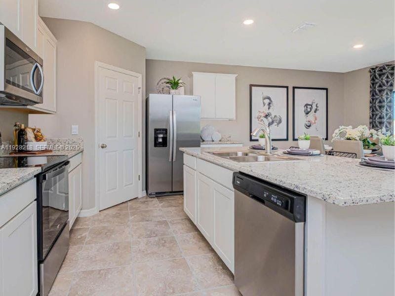 Furnished interior view inside a new home in , Fort Pierce (Image 5). Furnished interior view inside a new home in , Fort Pierce (Image 5).
