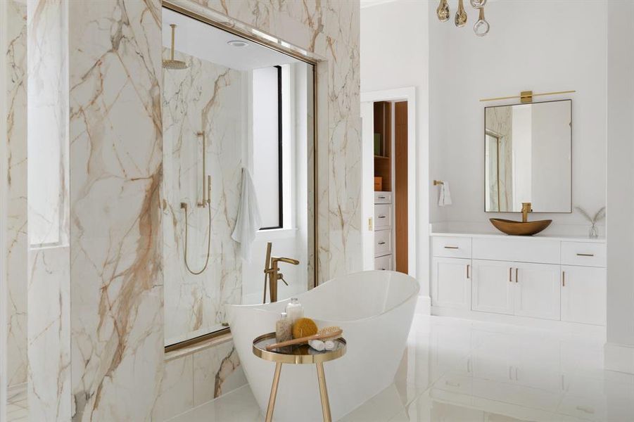 Indulge in the luxury of a resort-style bathroom with his-and-her vanities, a separate shower, and a lavish soaking tub for the ultimate relaxation experience.